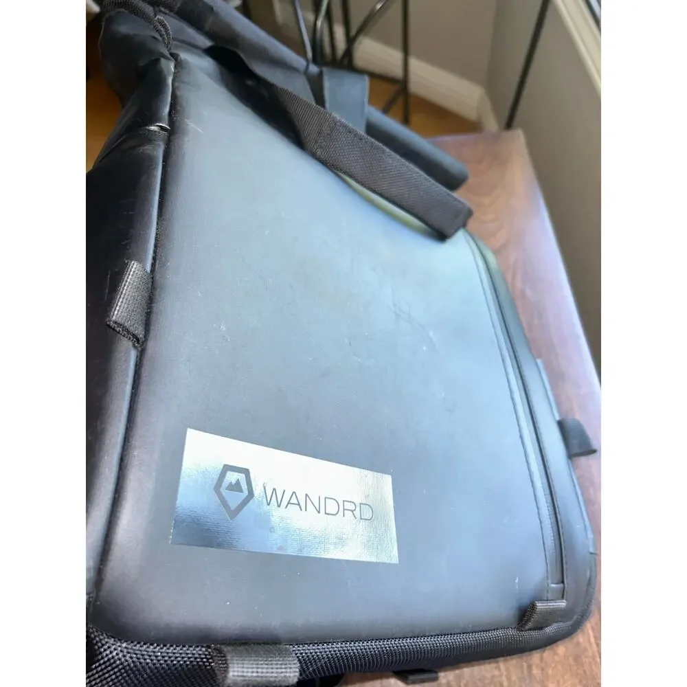 WANDRD PRVKE Lite travel camera backpack black roll-top closure magnetic handles